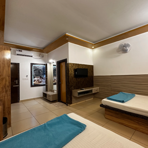 Cottage Interior With Two Sharing People Near Mysore Highways Elegant and cozy interior resort with modern decor and warm lighting for a restful stay